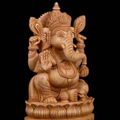 Wooden Ganesha Statue seated on ornate lotus pedestal with blessing hand.