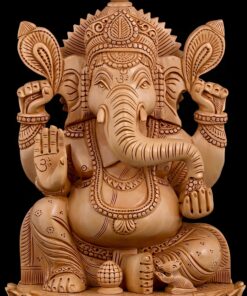 Wooden Ganesha statue with intricate carvings and Om symbols.