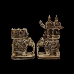 Intricately carved ivory elephant figurines with royal howdah, ceremonial decorations, and cultural craftsmanship.