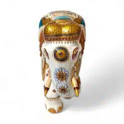 Colorful decorative elephant figurine with gold accents, floral patterns.
