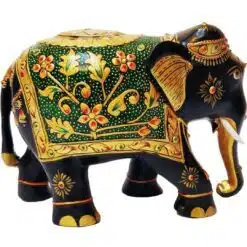 Decorative Indian elephant sculpture with floral patterns, gold accents, and symbolic raised trunk.