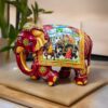Decorative Indian elephant figurine with intricate royal procession painting.