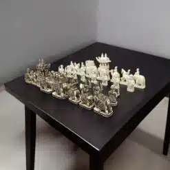 Camel bone chess pieces of elephant theme, white and antique finesh on a black color table