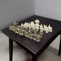 Camel bone chess pieces of elephant theme, white and antique finesh on a black color table