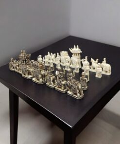 Camel bone chess pieces of elephant theme, white and antique finesh on a black color table