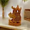 Decorative wooden elephant sculpture with Howdha and cultural craftsmanship.