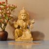 Wood or ivory statue of spiritual figure with blessing gesture,