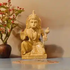Wood or ivory statue of spiritual figure with blessing gesture,