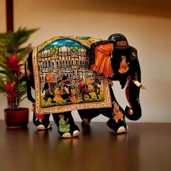 Colorful decorative Indian elephant sculpture with intricate patterns, regal scene, and vibrant traditional details.