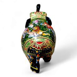 Wooden elephant figurine with intricate patterns, cultural motifs, and decorative lid, handcrafted art piece.