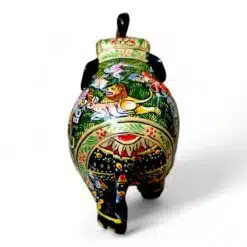 Wooden elephant figurine with intricate patterns, cultural motifs, and decorative lid, handcrafted art piece.