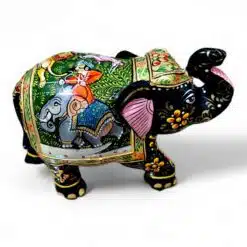 Decorative Indian elephant figurine with vibrant colors, intricate carvings, and royal scene artwork.