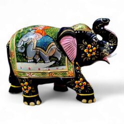 Colorful handcrafted elephant figurine with intricate patterns, vibrant colors, and cultural traditional artistry.