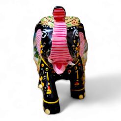 Colorful decorative elephant sculpture with floral patterns, vibrant colors.