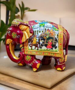 Decorative Indian elephant figurine with intricate royal procession painting.