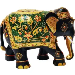 Decorative Indian elephant sculpture with floral patterns, gold accents, and symbolic raised trunk.
