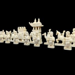 Intricately carved Asiancamel bone chess set with ceremonial figures, knights, warriors,