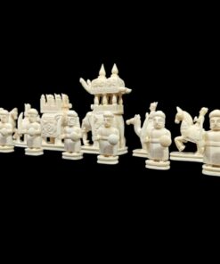 Intricately carved Asiancamel bone chess set with ceremonial figures, knights, warriors,
