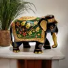Colorful handcrafted elephant figurine with gold accents, floral patterns, and intricate detailing.