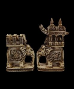 Intricately carved ivory elephant figurines with royal howdah, ceremonial decorations, and cultural craftsmanship.