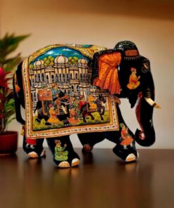 Colorful decorative Indian elephant sculpture with intricate patterns, regal scene, and vibrant traditional details.