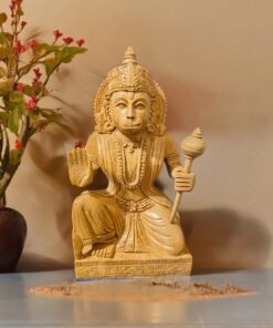 Wood or ivory statue of spiritual figure with blessing gesture,