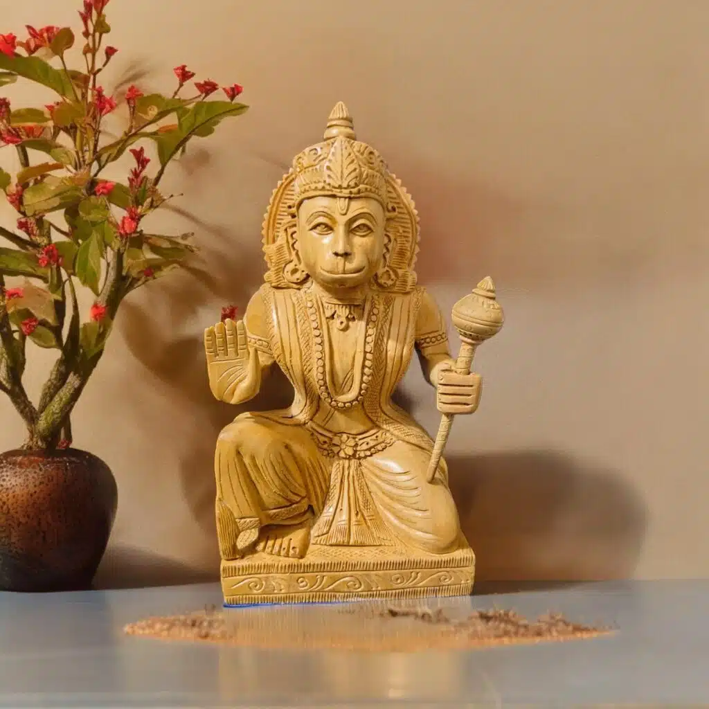 Wood or ivory statue of spiritual figure with blessing gesture,