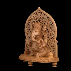 Wooden Ganesha statue with intricate carved arch and ornate devotional details.