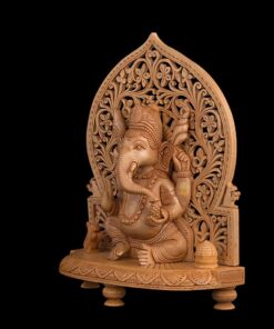 Wooden Ganesha statue with intricate carved arch and ornate devotional details.
