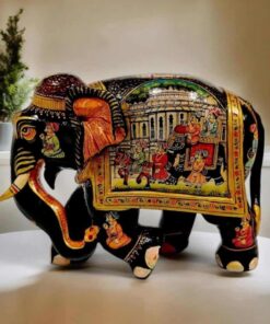 Rajasthani royal painting with black gold color theme and royal king Sawari painted on elephant.