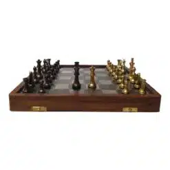 Brass chess set on a wood chess board