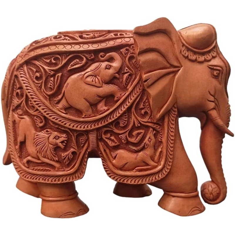 Handmade elephant sculpture with flower carving and animal figure on its body