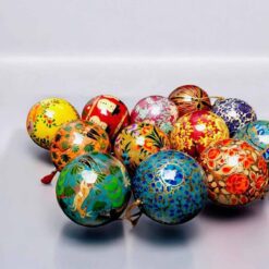 Colorful festive ornaments with intricate patterns, floral motifs, and whimsical designs.