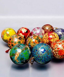 Colorful festive ornaments with intricate patterns, floral motifs, and whimsical designs.