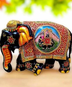 wooden elephant painted with flower design and Ambari elephant painted on it.