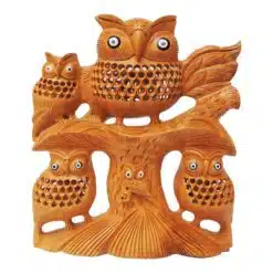 Wooden owl sculpture with three baby owl siting on wood tree jail and inlay work on it.
