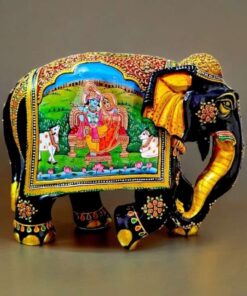 wooden elephant painted with Radha Krishna figurines miniature painting on it