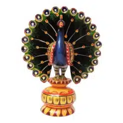 wooden peacock hand painted with water color sitting on painted wood stand