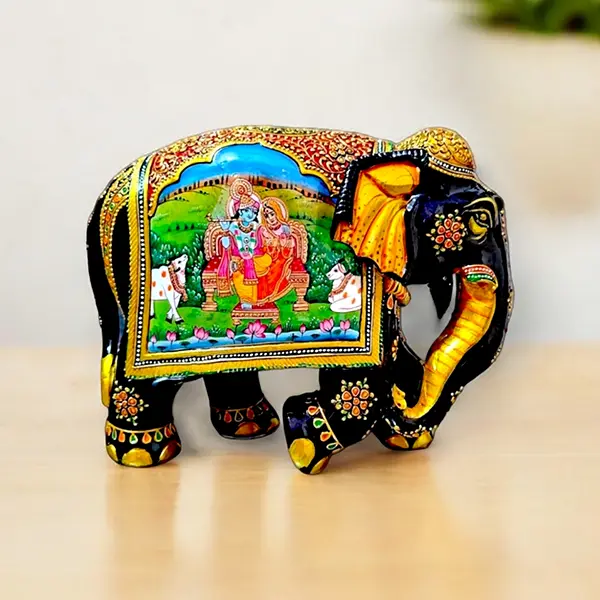 wooden elephant painted with Radha Krishna Painting on it