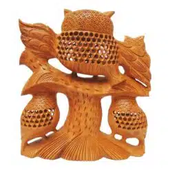 wooden owl sculpture with undercut jail work back side of carving design