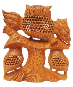 wooden owl sculpture with undercut jail work back side of carving design