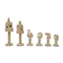 Elegant animal-themed ivory chess set with intricate carvings and organic, whimsical design.