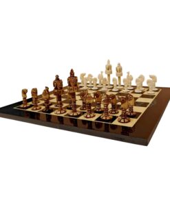 bone chess set on checkered board with detailed white and dark brown pieces.