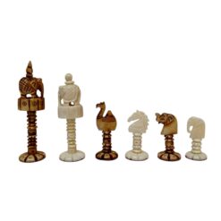 Artistic handcrafted chess pieces featuring cultural motifs and intricate animal and figure designs.