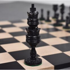 Black rook chess piece on a classic chessboard with detailed craftsmanship and strategic gameplay elements.