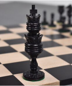 Black rook chess piece on a classic chessboard with detailed craftsmanship and strategic gameplay elements.