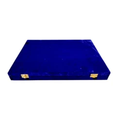 Luxury blue velvet jewelry box with brass clasps and elegant craftsmanship.