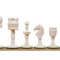 Elegant bone chess set with detailed carved pieces on green felt bases.