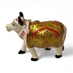 Decorative Indian ceramic cow figurine with colorful floral patterns and gold accents.