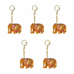 Colorful elephant keychains with intricate patterns and gold accents for cultural and decorative use.